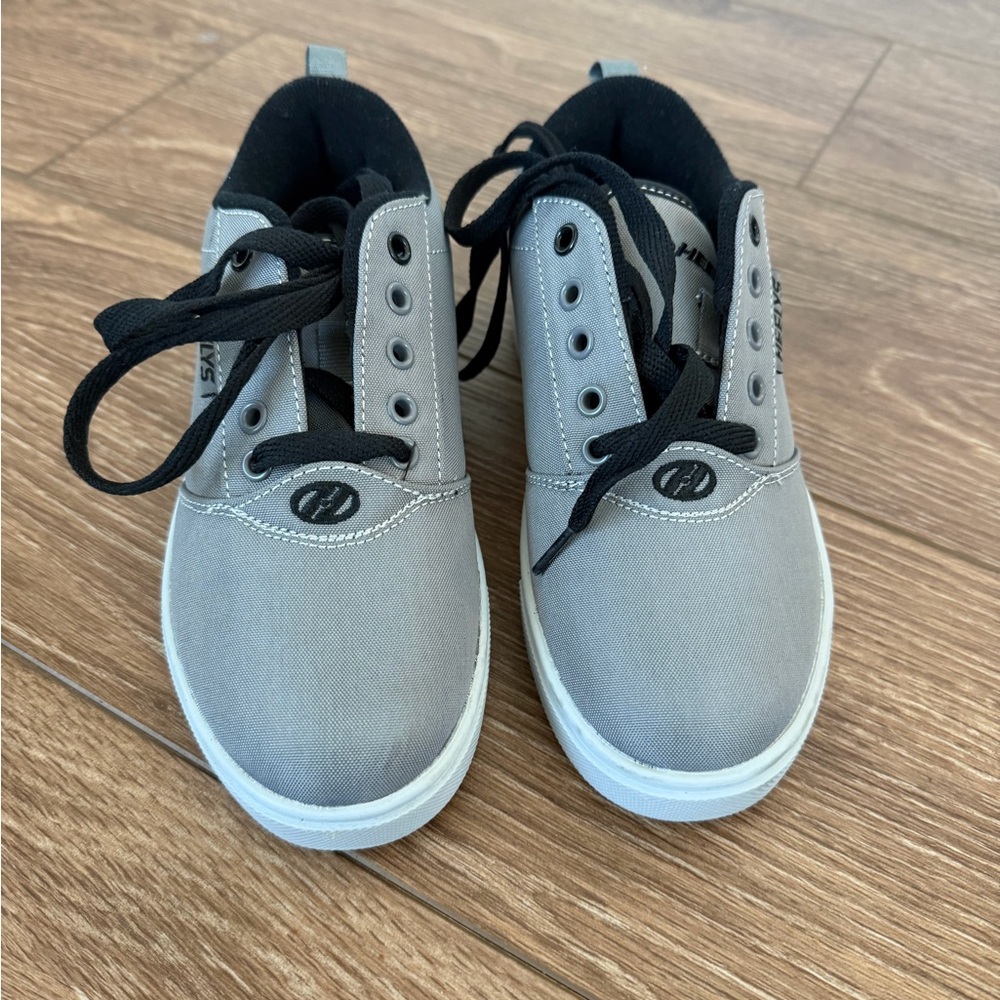 Brand new never worn

Heelys Gray Canvas Kids Sneakers with Black Laces